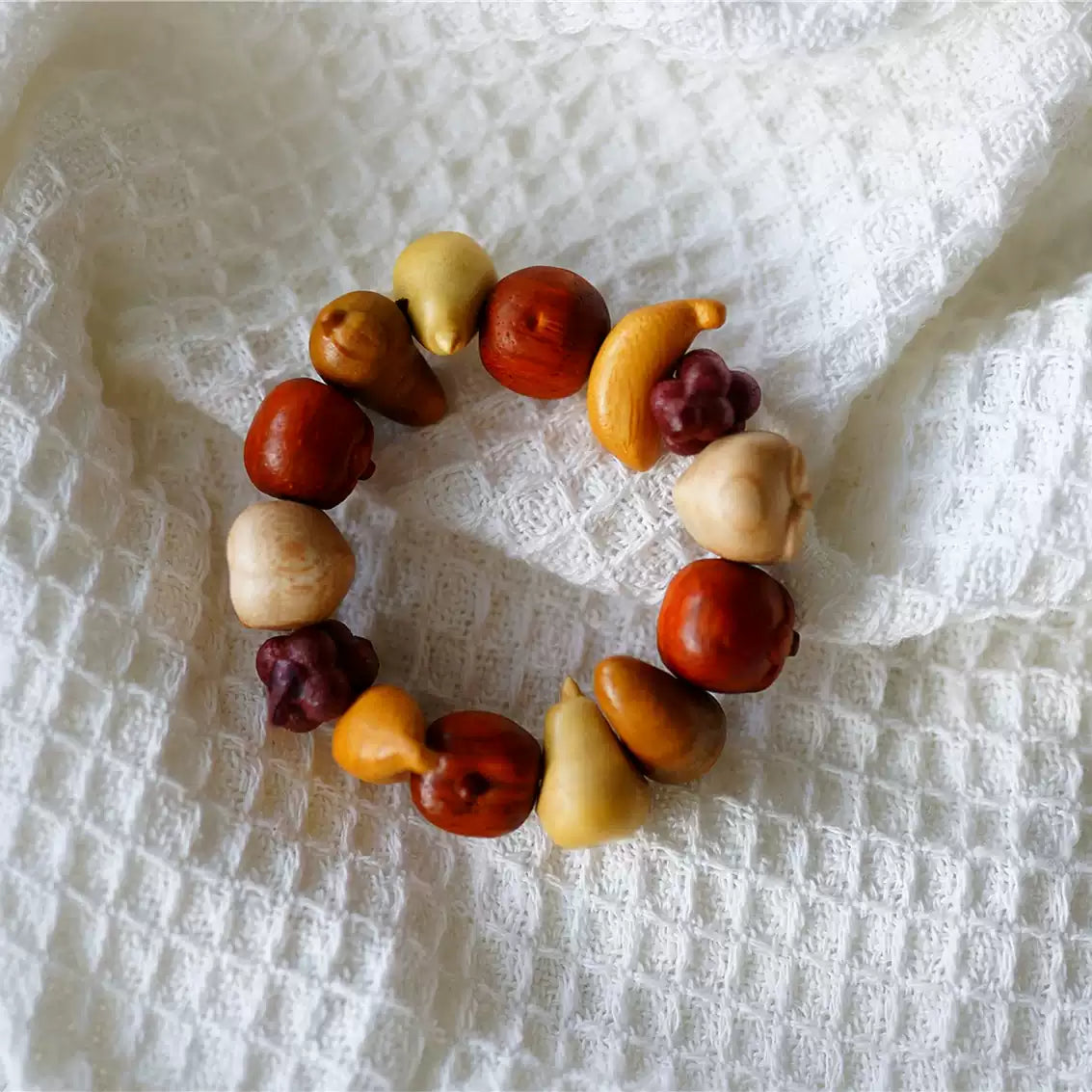 Hand-carved fruit bead bracelet